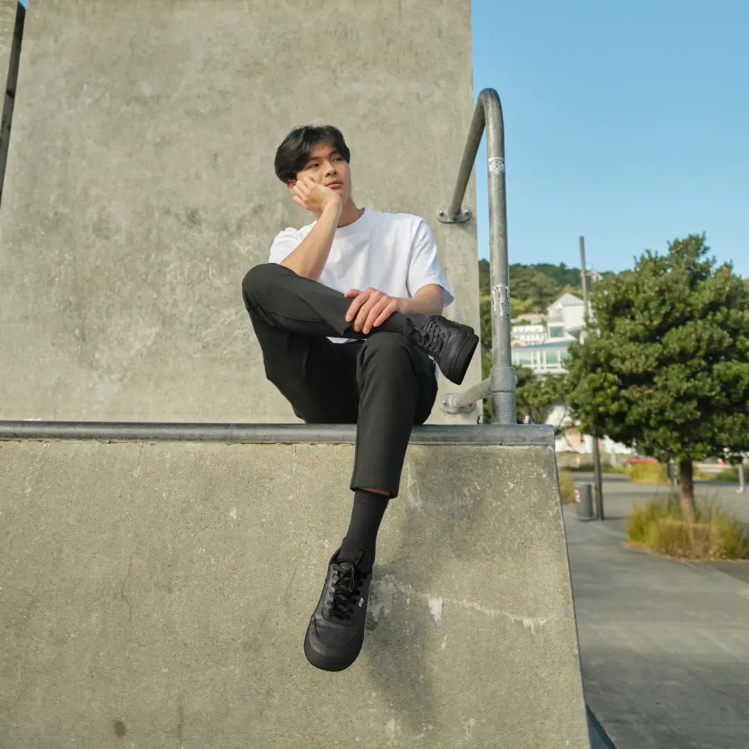 Man wearing Orba Ghost Black/ Black sneaker at skatepark