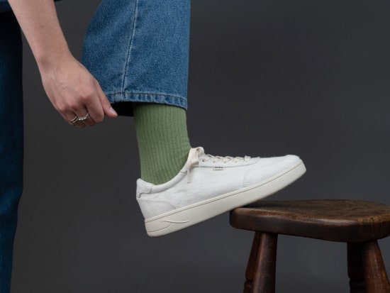Orba Ghost sneaker on wooden stool