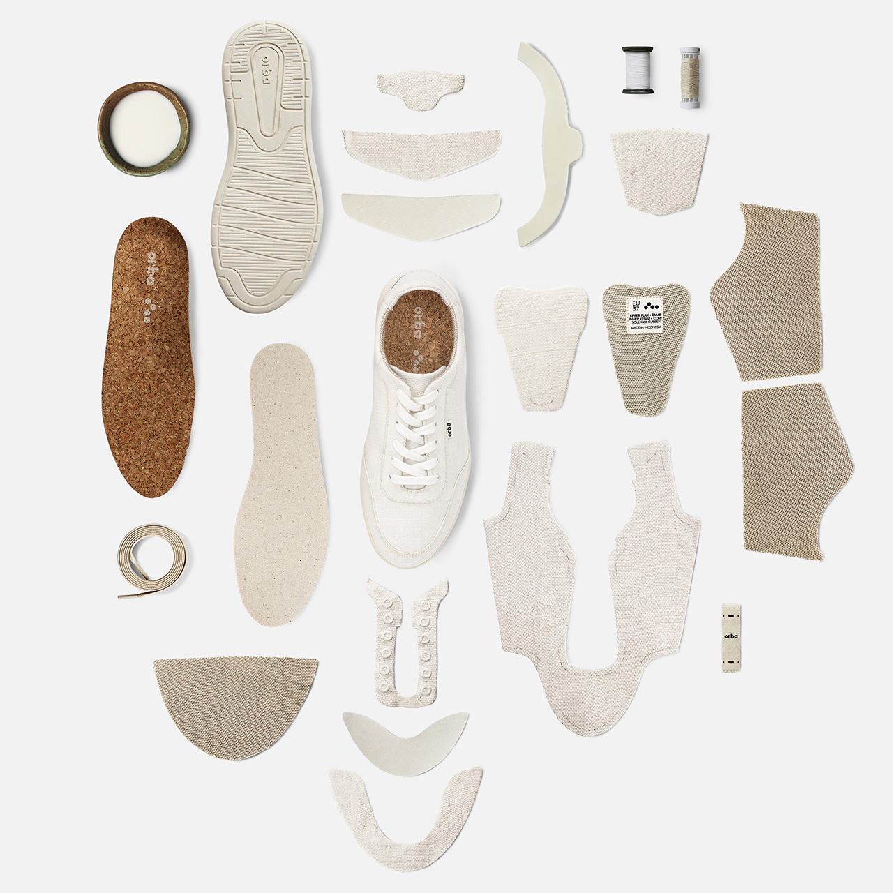 All components of Orbas plant-based Ghost sneaker laid flat